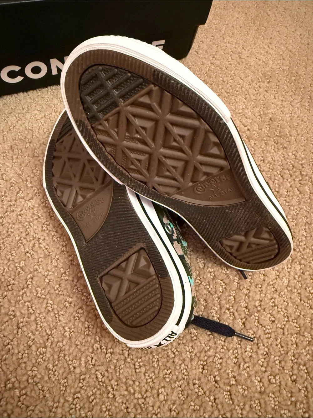 New in box. Converse low sneakers. Size 12